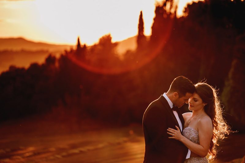 Bride and groom portrait in tuscany italy at sunset of a destination wedding - incredible wedding portraits by Oben Studio®
